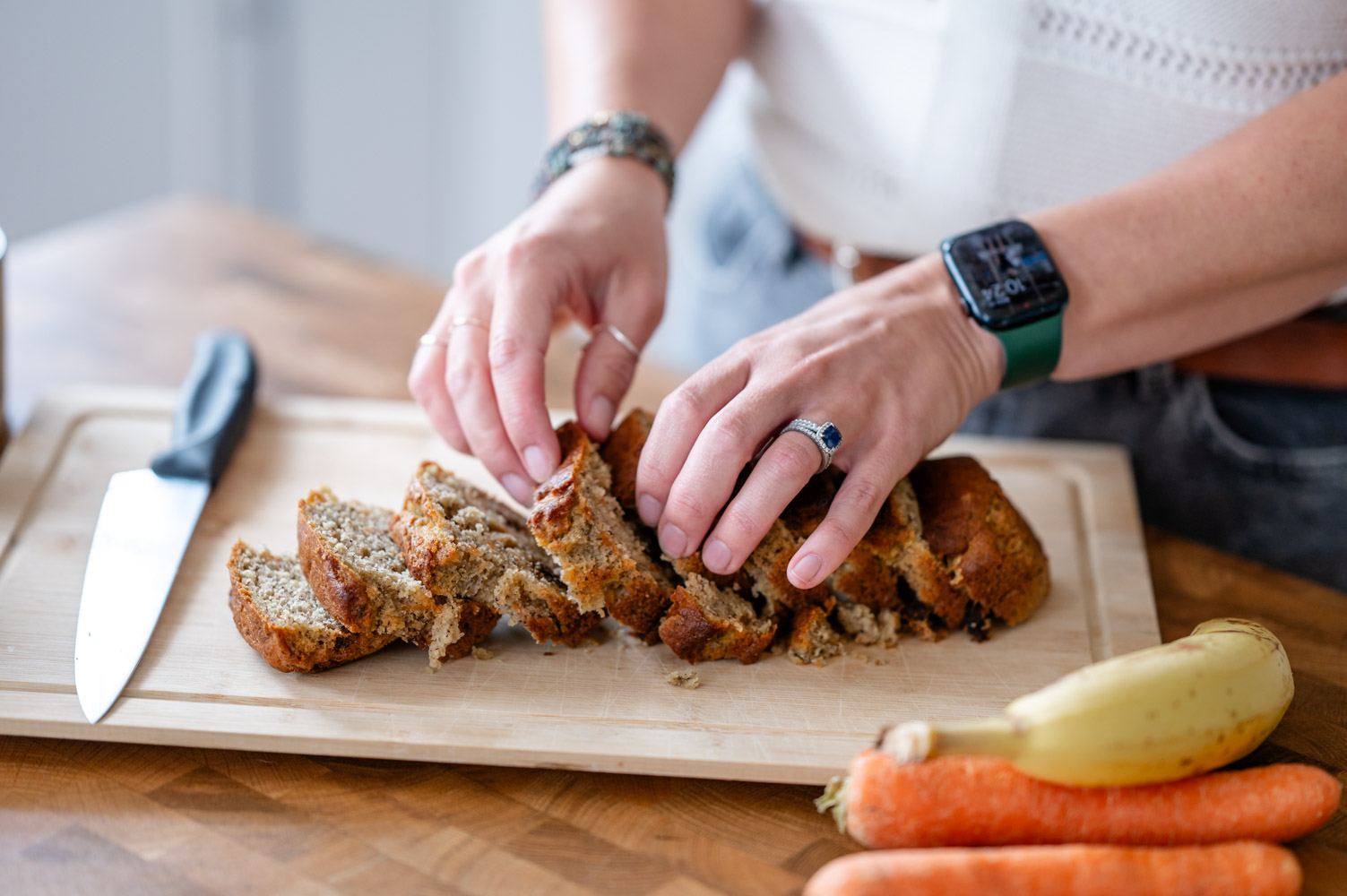 a close up of a nutritionist preparing banana bread during her Watford branding photoshoot