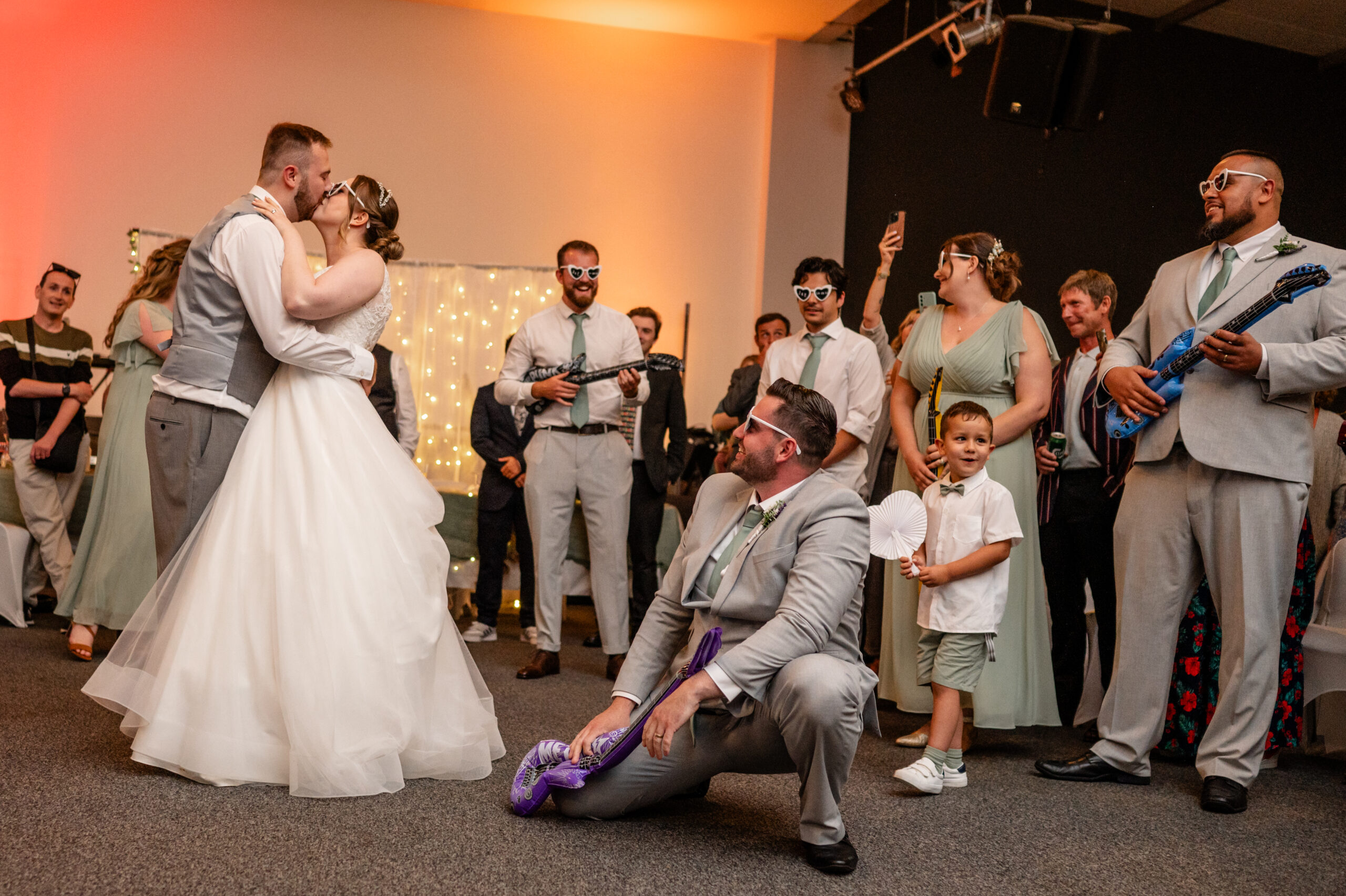 bride and groom air guitar dancefloor