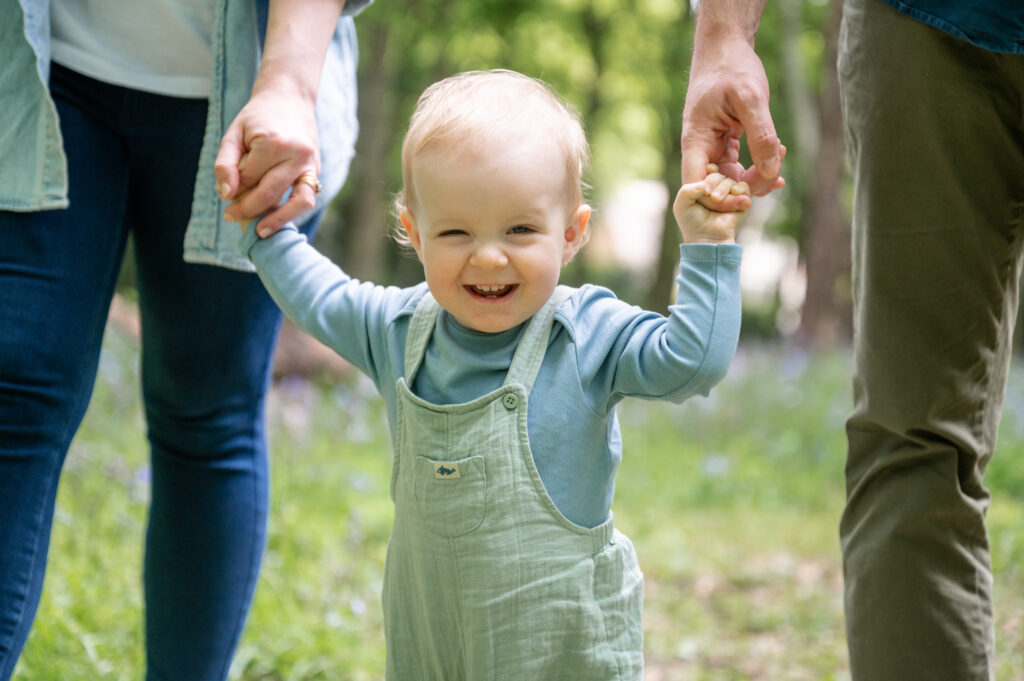 baby in bluebell woods