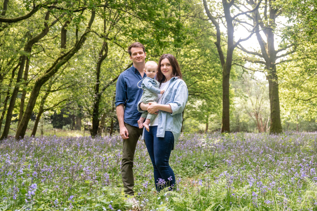 family in bluebell woods