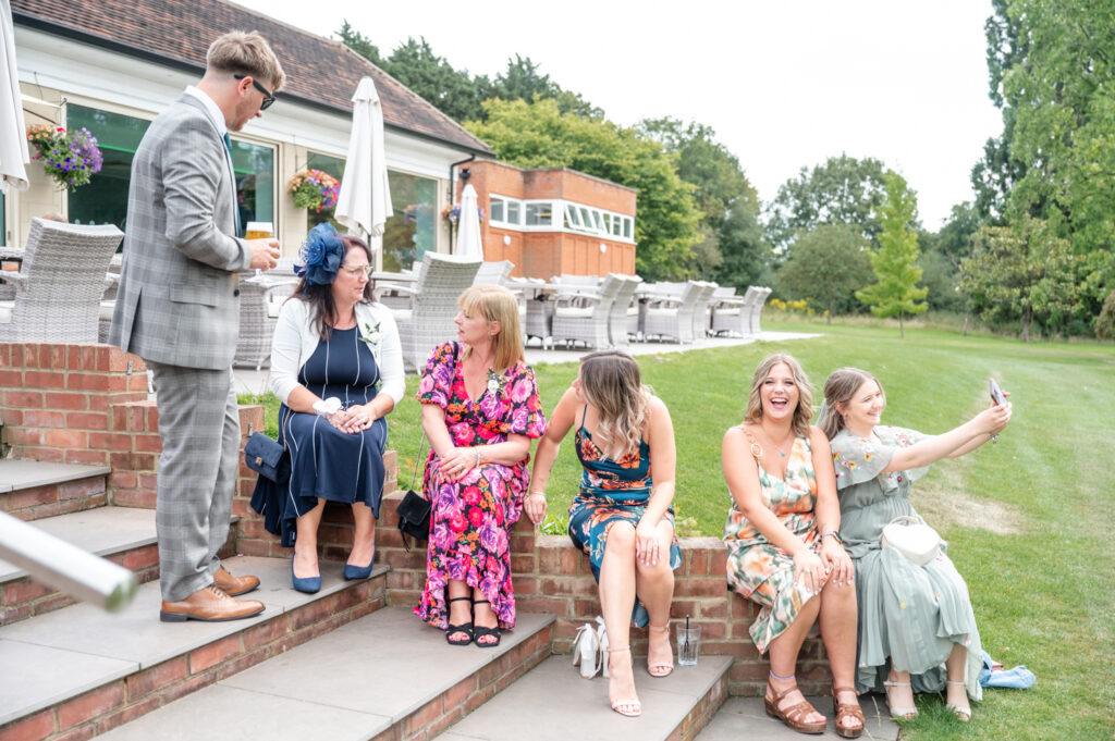 guests having fun at a gold club wedding