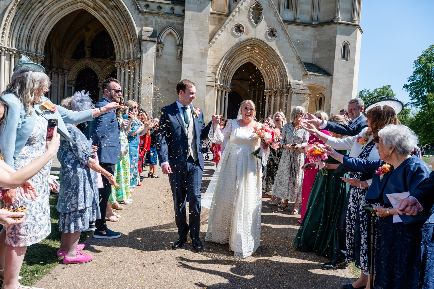 A St Albans wedding photographer captures confetti outside St Albans Cathedral