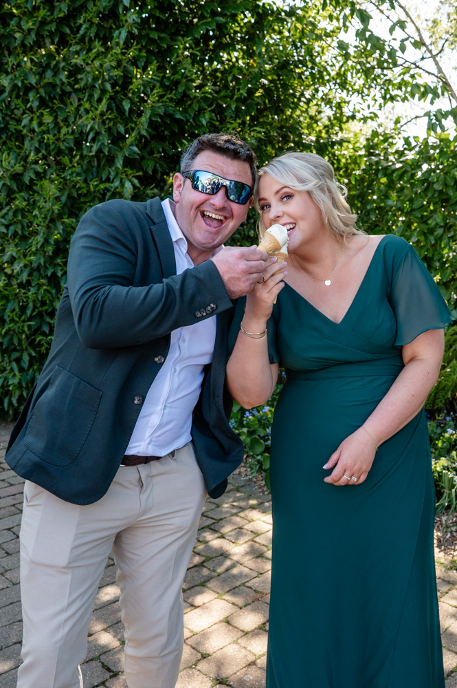 Wedding guests enjoying ice cream from the vintage ice cream van at TewinBury Farm.”