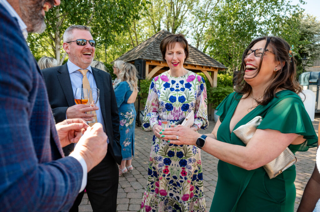 Unposed candid of friends enjoying the outdoor reception space