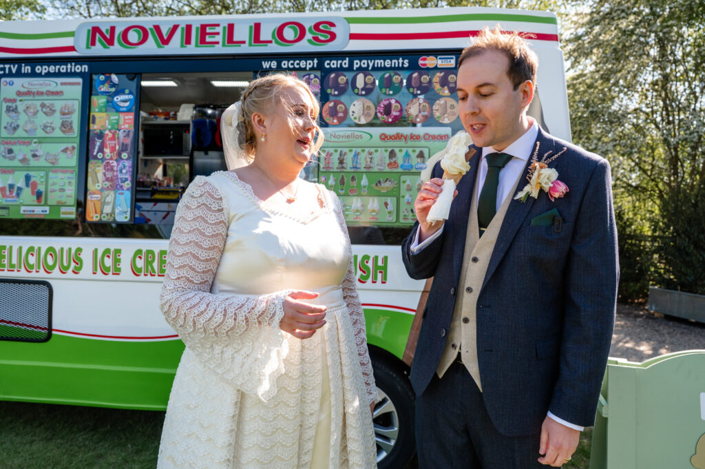 Bride and groom holding ice creams at their TewinBury Farm wedding.