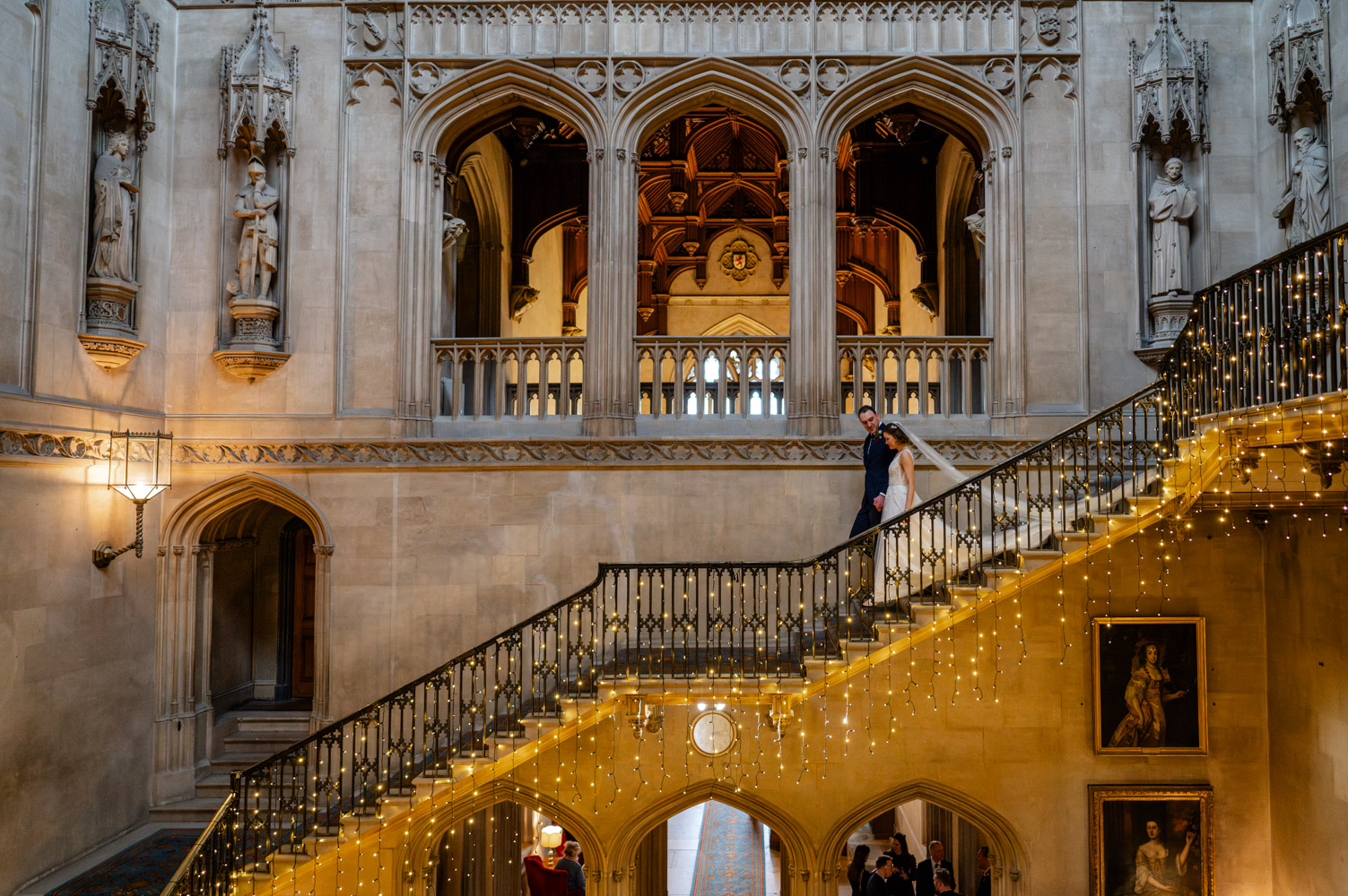 Annabel and Phil posing for intimate couple portraits in the conservatory at Ashridge House, Hertfordshire winter wedding.
