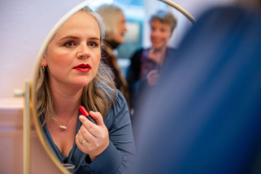 Bride doing her make up at Islington Town Hall for a London micro wedding