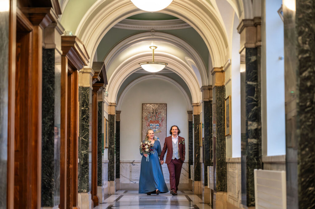 Bride and groom portraits in the marble corridors of Islington Town Hall, London