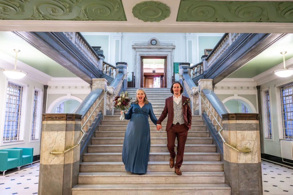 Micro wedding couple photographed on the staircase at Islington Town Hall