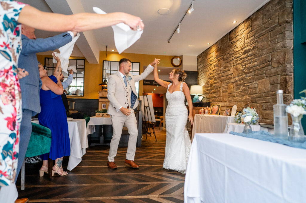 The new mr&mrs enter the wedding breakfast at their St Albans pub wedding