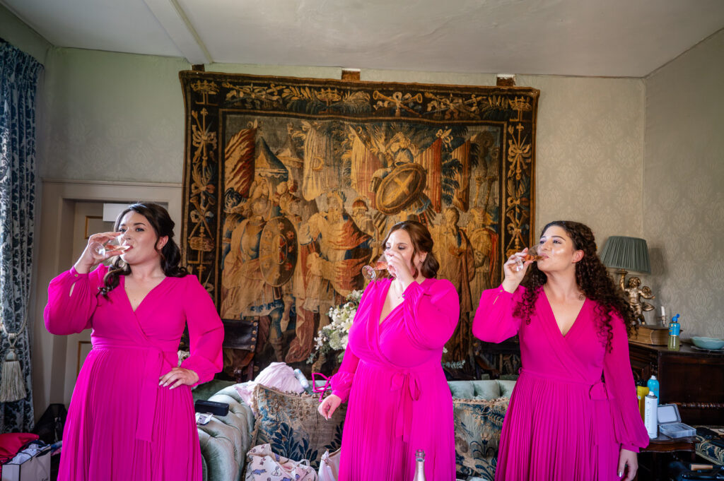 bridesmaids getting ready at Chenies Manor captured by a Watford wedding photographer