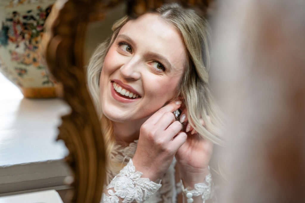 a bride getting ready for her Chenies Manor wedding