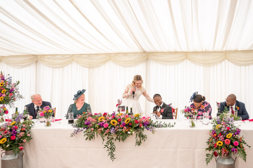 Speeches in the marquee at a Chenies Manor Wedding