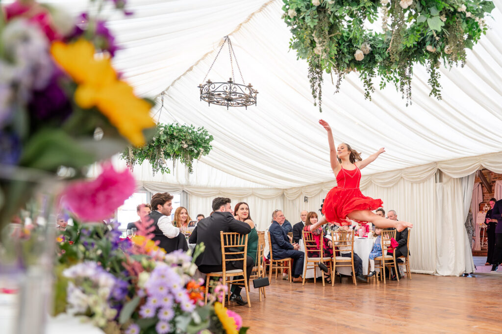 a dancer performs at a wedding breakfast captured by As You Are Photography