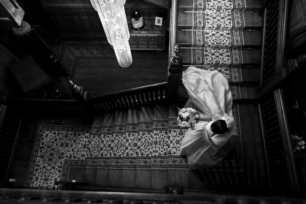 bride walking down the stairs at Berwick House, Shrewsbury