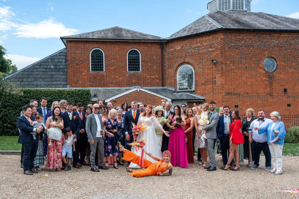 A fun wedding photo of all the guest at King's Chapel, Amersham.